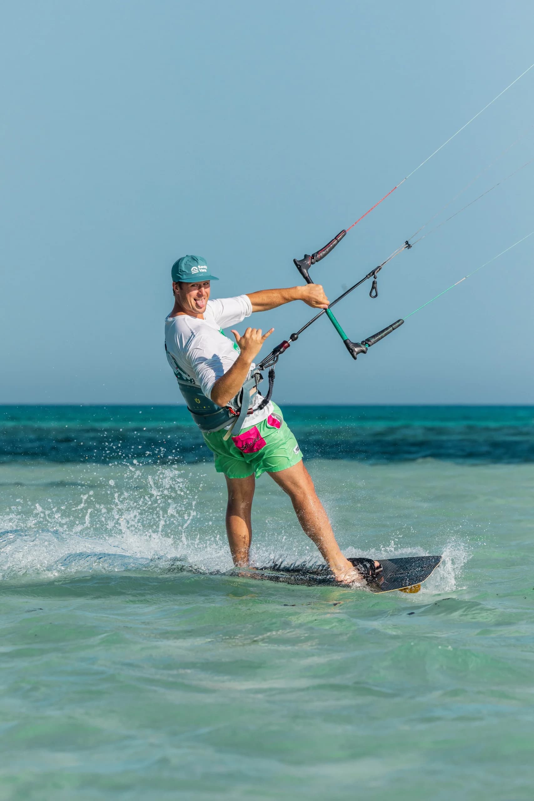 Wing foil student holding an inflatable wing over flat water during a lesson in Hurghada